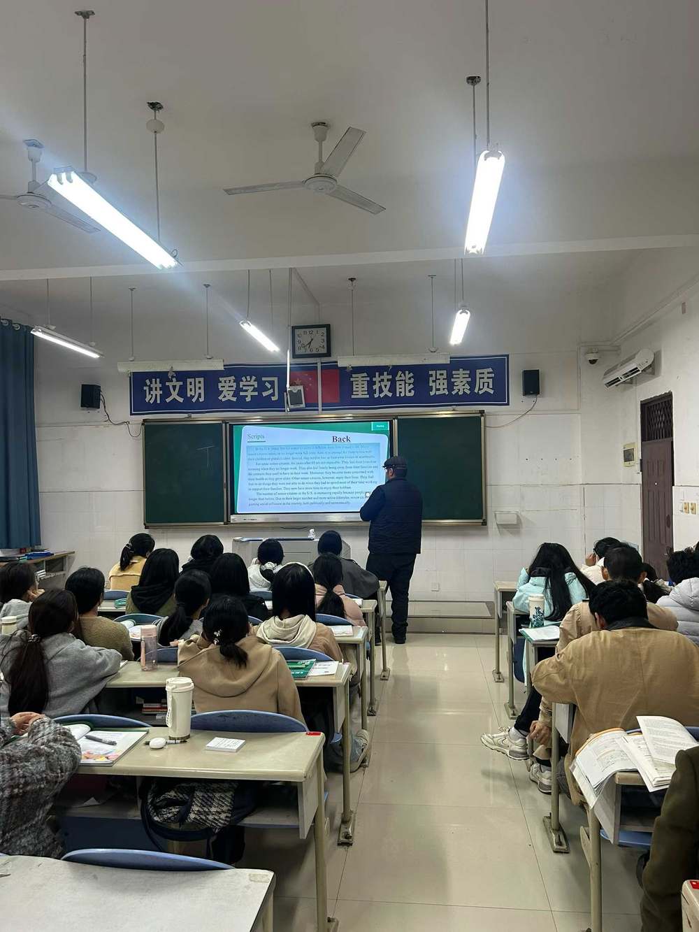 A volunteer leading a lesson in a Chinese classroom in Mianyang